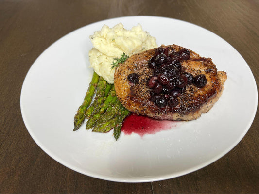 Pork Loin Medallions topped with Blueberry Balsamic Sauce served with Creamy Rosemary Thyme Mashed Potatoes and Oven Roasted Asparagus
