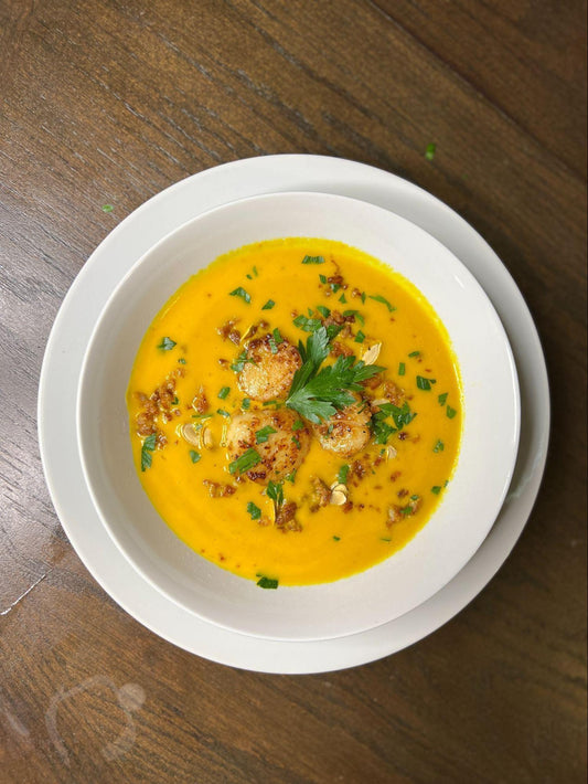 Coconut Curry Soup topped with Seared Sea Scallops and Fried Pork Belly Bits
